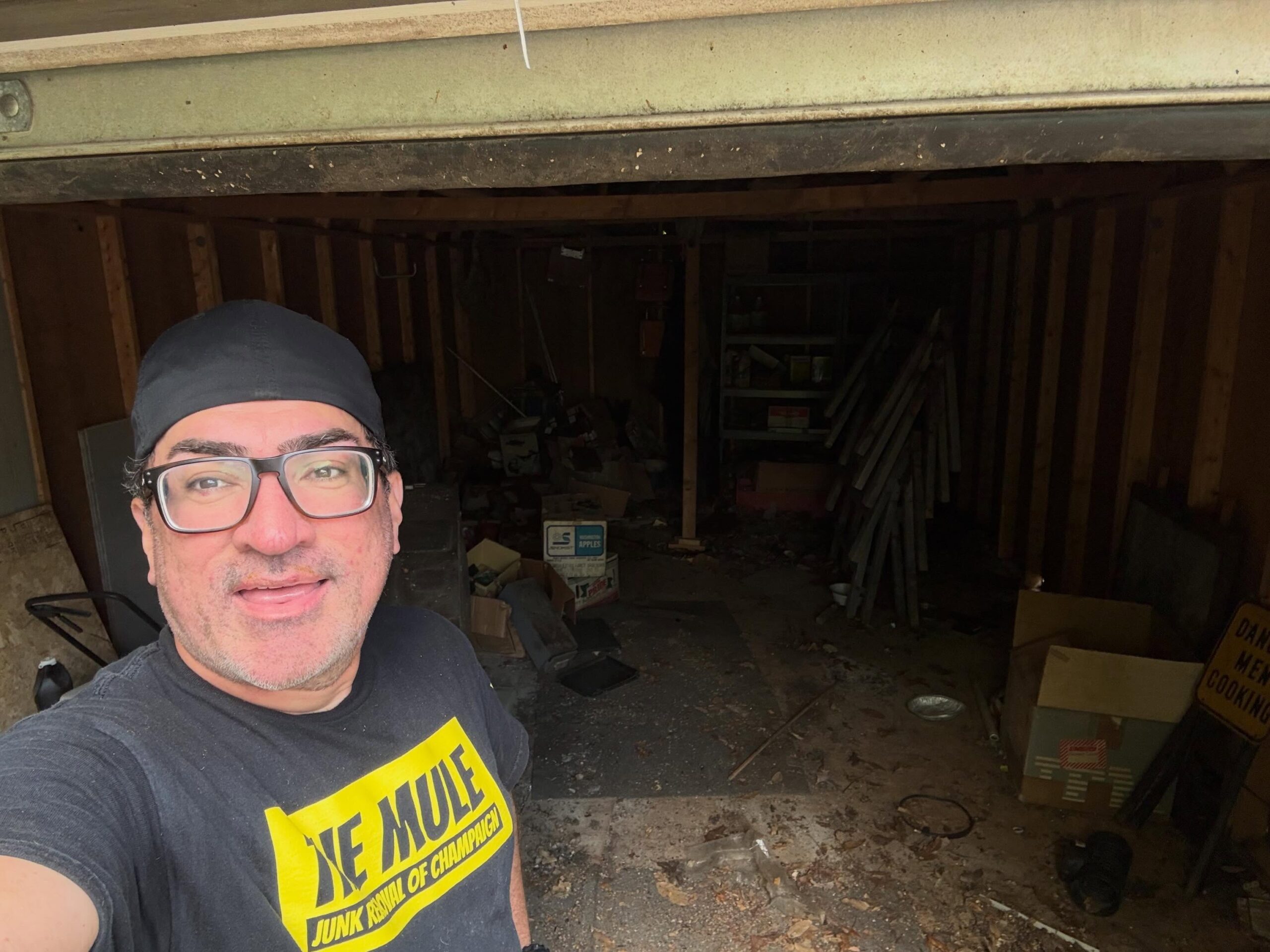 Garage and basement cleanout in Champaign IL – The Mule Junk Removal clearing accumulated furniture, boxes and debris